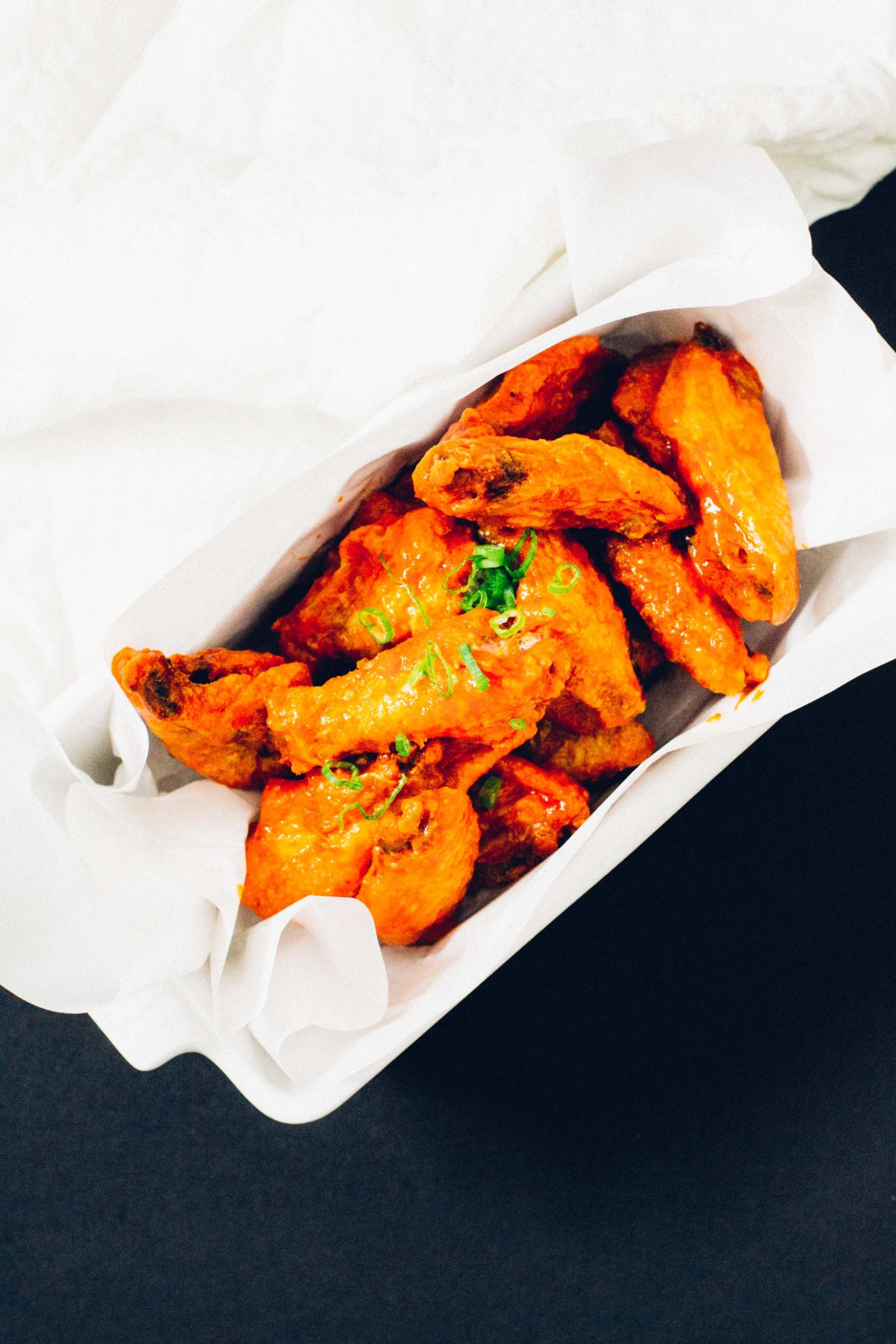 Oven-fried keto sriracha buffalo wings.