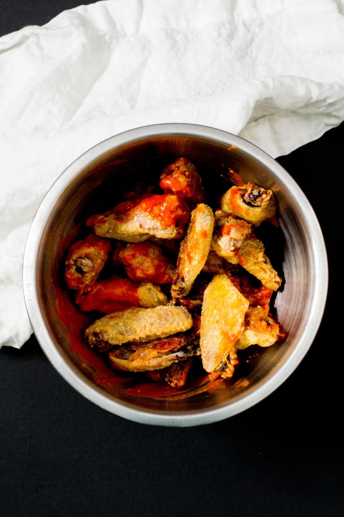 Oven-fried keto sriracha buffalo wings.