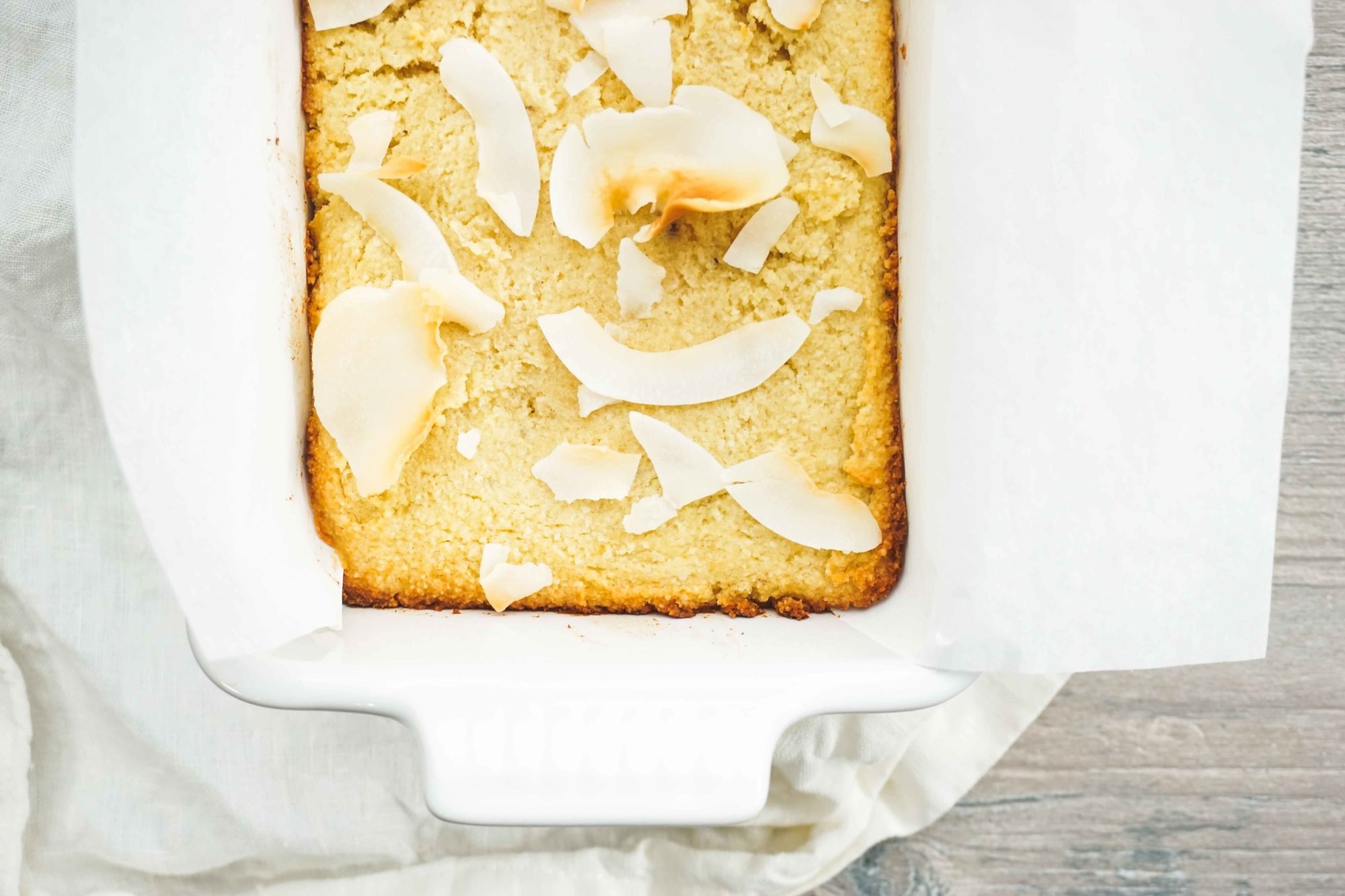 Bread with coconut crunches on top.