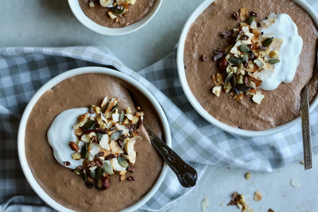 Keto chocolate chia pudding with toasted nut crunch.