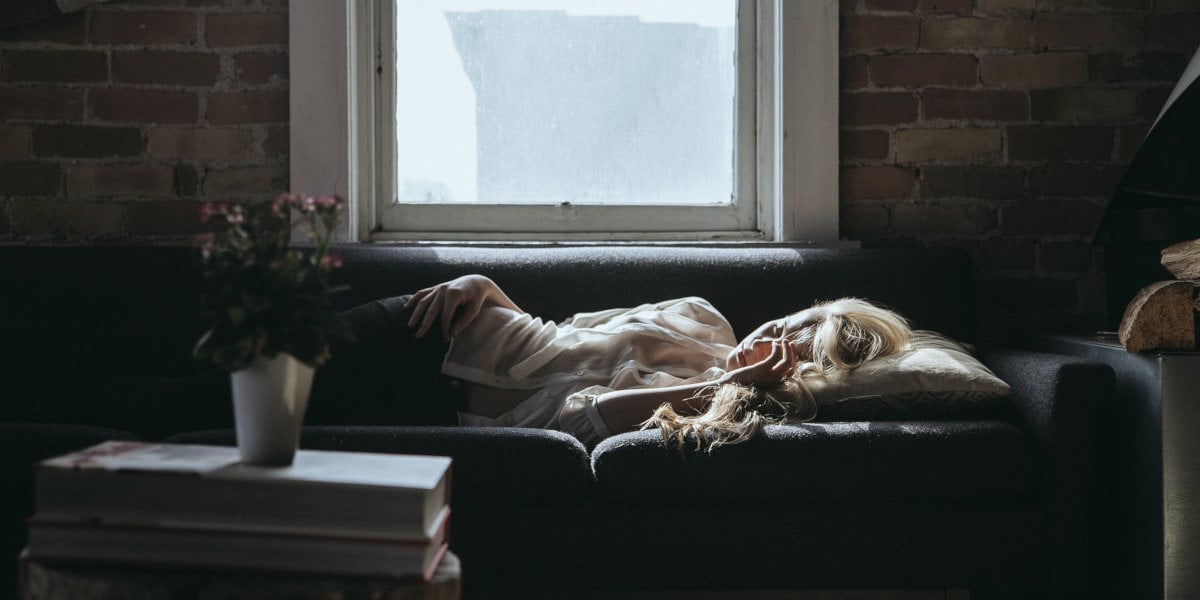 woman sleeping on a sofa