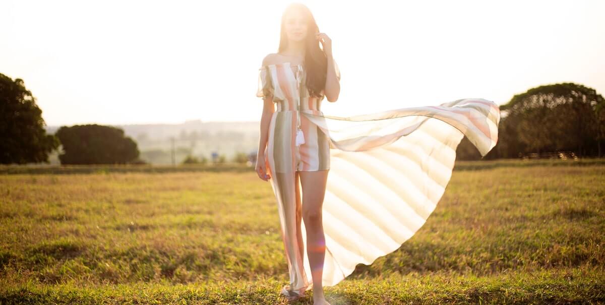 woman standing alone in a field