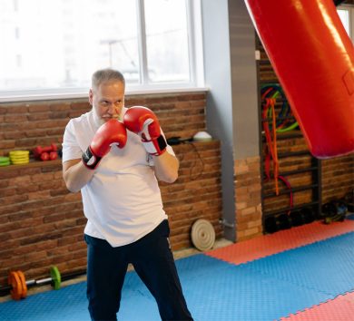 Picture of an old man training boxing