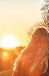 Picture of a woman looking at the sun